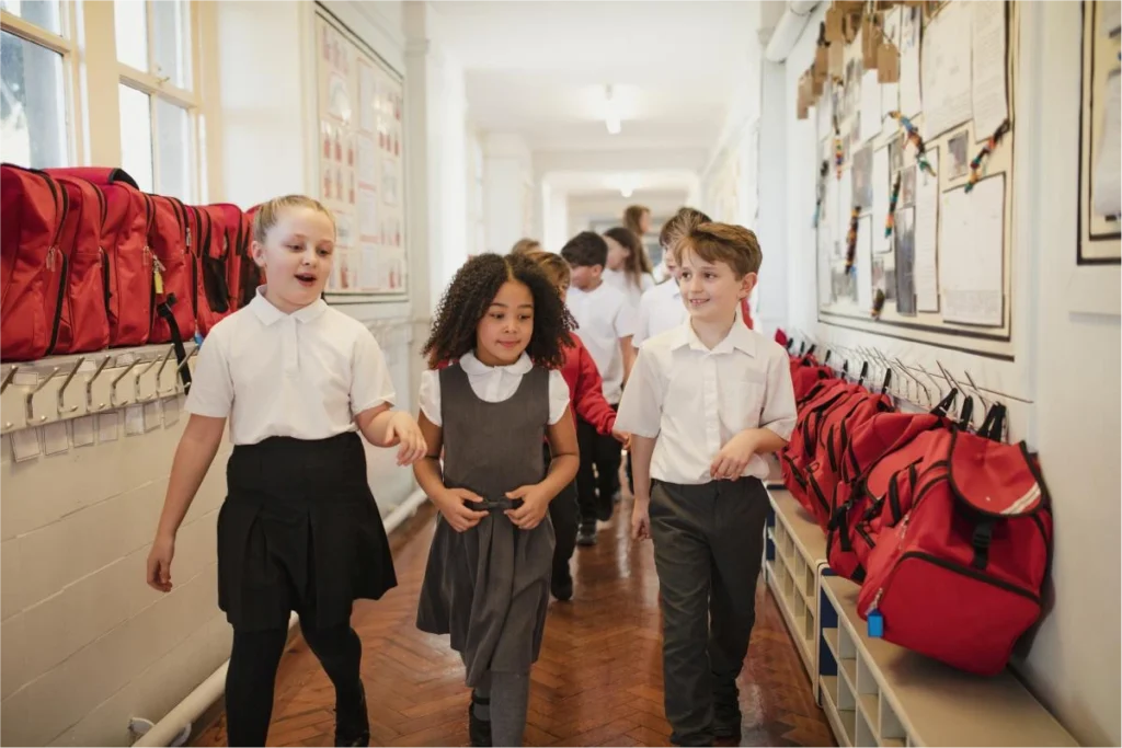 School children walking down a school corridor
